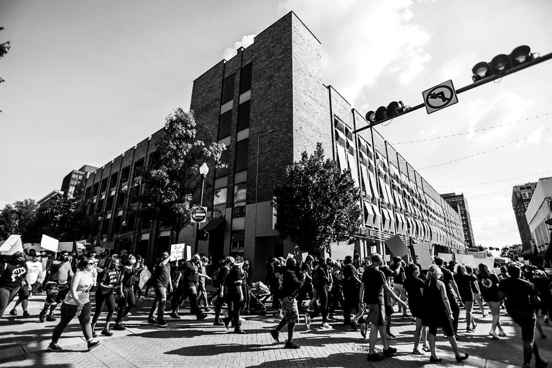 Black and white photo of public demonstration in downtown Huntsville, AL